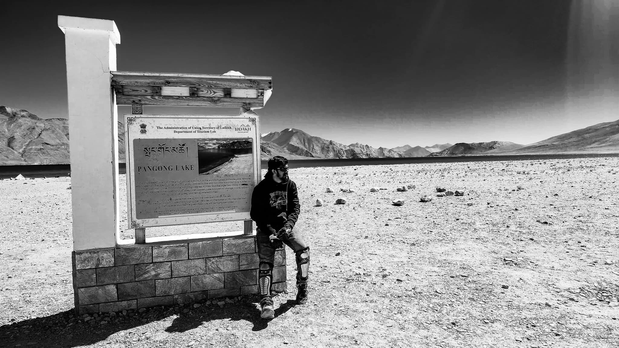 A traveller standing at Pangong Lake, Ladakh